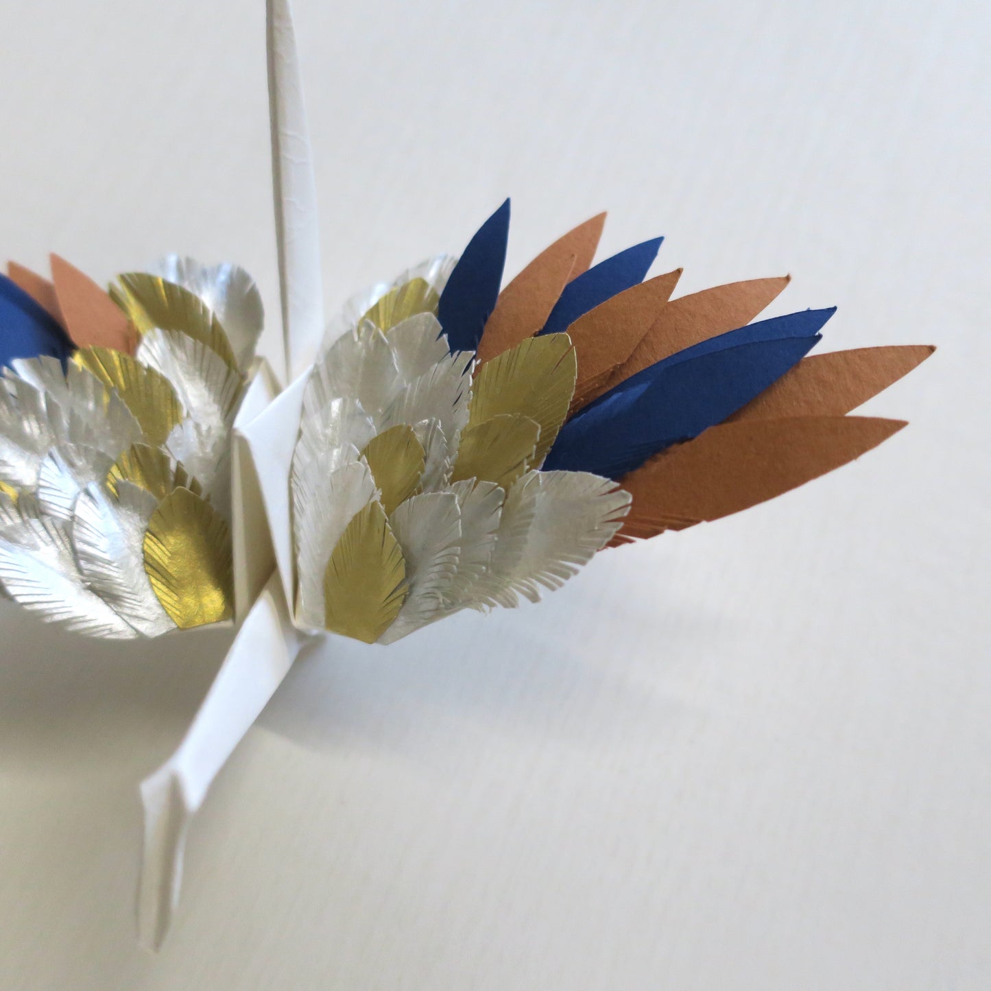 Grulla emplumada de origami - Sol