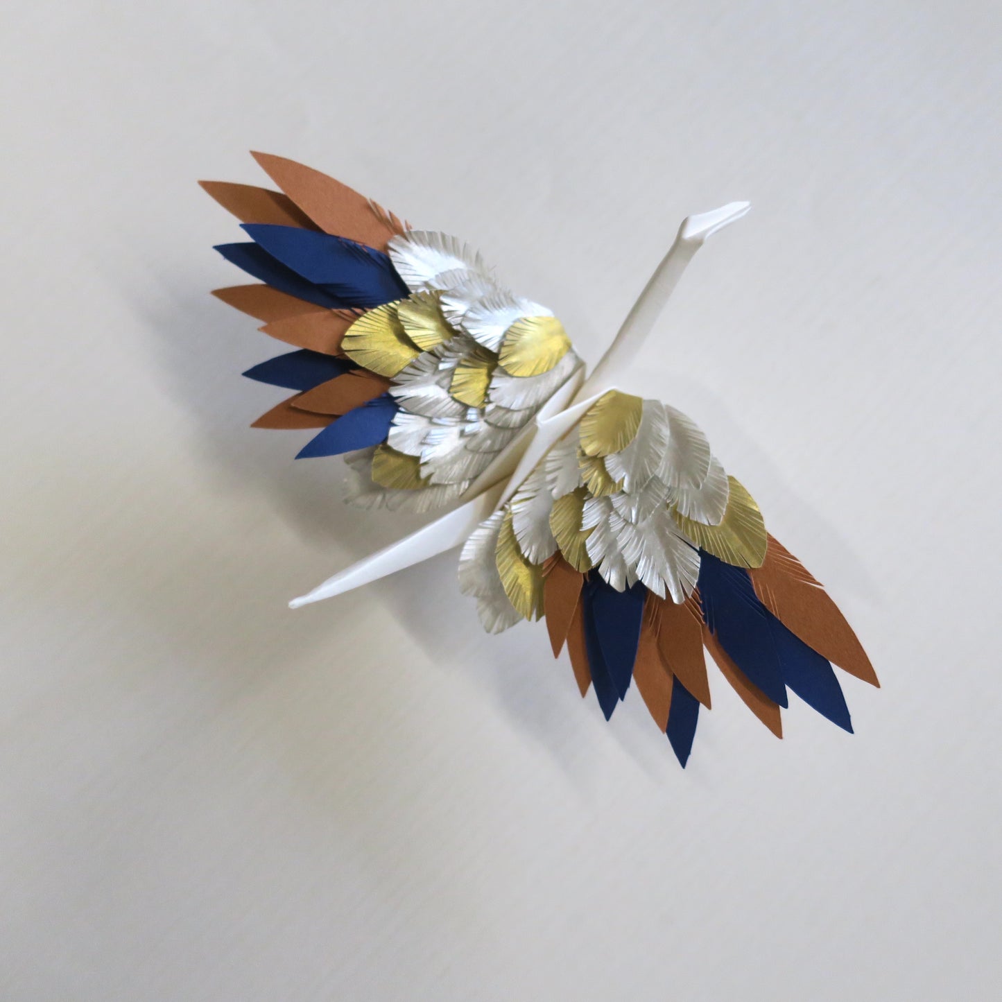 Grulla emplumada de origami - Sol